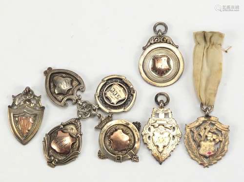 Eight silver sports jewels, approximate weight 67.5g : For Further Condition Reports and Live