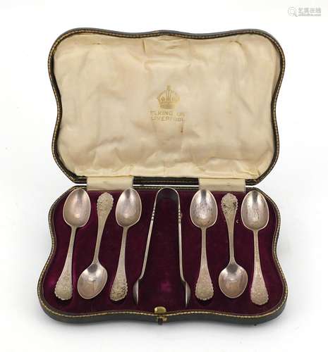 Set of six silver sugar tongs and teaspoons, by Elkington & Co Birmingham 1909, housed in a tooled