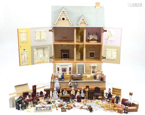 Large wooden dolls house with a large selection of furniture and accessories, the house with The