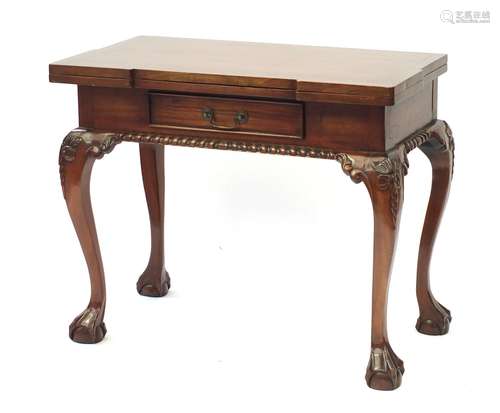 Reproduction mahogany games table, the opening top with chess and backgammon board on carved