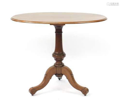 Oval walnut occasional table on turned column and tripod base, 74cm H x 90cm W x 60cm D : For