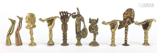 Ten antique pipe tampers including Nelson, Shakespeare and devil design examples, the largest 6.