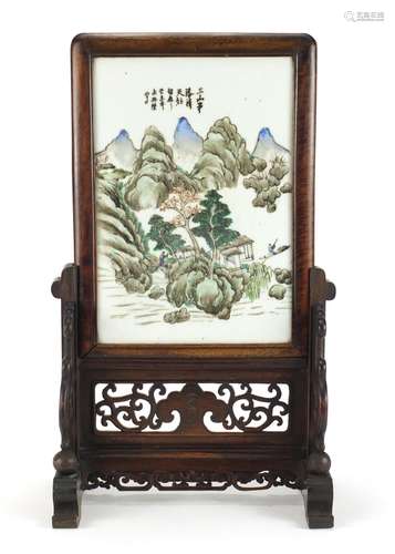 Chinese hardwood table screen housing a porcelain panel hand painted with figures in a river