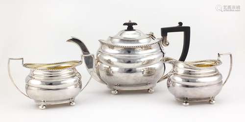 Silver three piece tea set, by Josiah Williams & Co London 1928 and 1931, the teapot 15.5cm high,