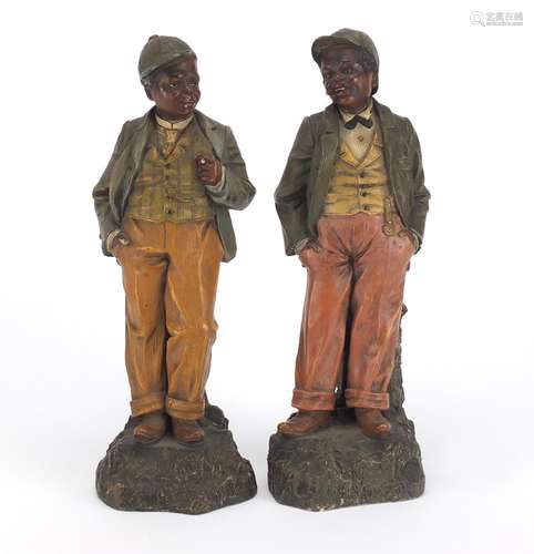 Pair of 19th century hand painted terracotta figures of Blackamoors, each with impressed marks and