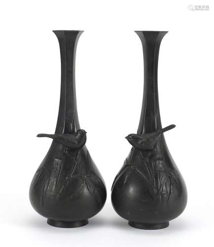 Pair of Japanese Meiji period patinated bronze vases, each cast in relief with a bird amongst