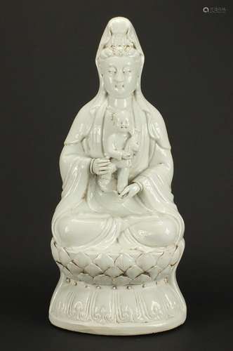 Large Chinese Blanc de Chine porcelain figure of Guanyin holding a young child, impressed