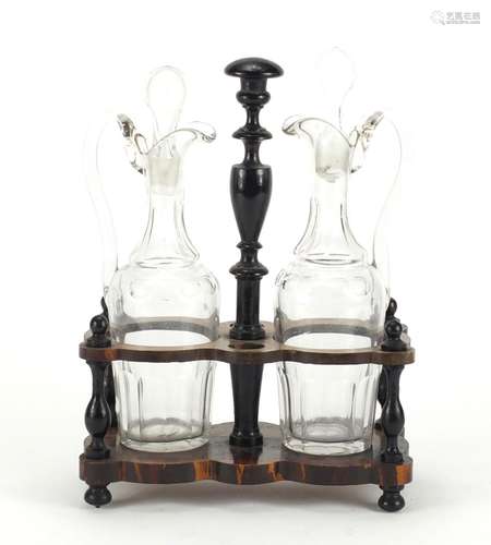 Pair of antique oil and vinegar decanters, housed in an ebonised stand, 28cm high : For Further