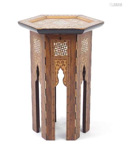 Moorish hexagonal inlaid occasional table with mother of pearl inlay depicting script, 47cm high :