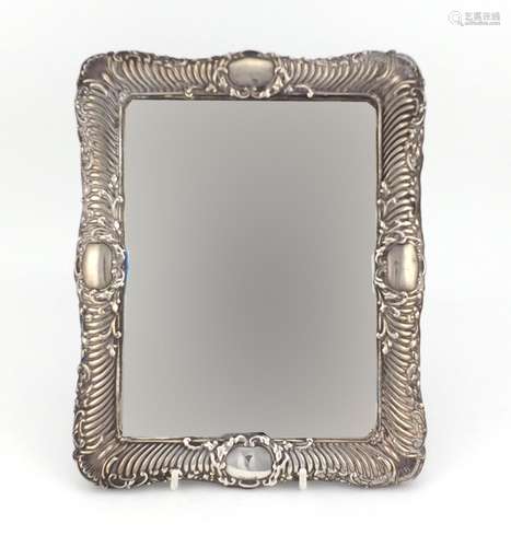 Rectangular silver easel mirror embossed with leaves and shells, indistinct hallmarks, RD number