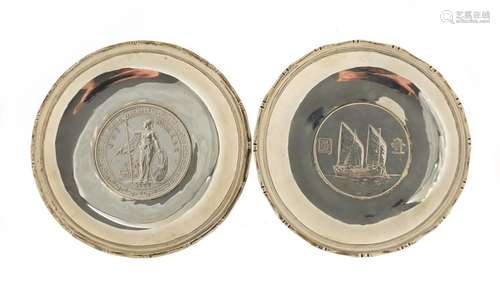 Two Chinese sterling silver coin dishes, both with impressed marks, each 9cm in diameter,