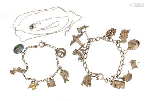 Silver charm bracelet with a selection of mostly silver charms including aeroplane, post box,