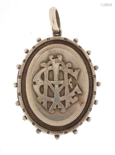 Victorian aesthetic unmarked silver locket, 5.8cm in length, approximate weight 23.2g : For