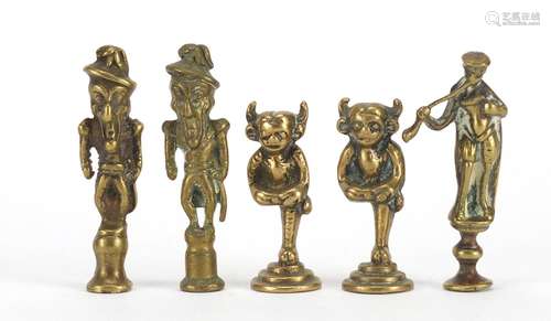 Five antique pipe tampers comprising two devil and three figural design examples, the largest 7cm