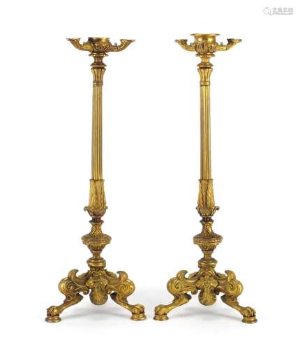 Pair of 19th century ormolu candlesticks with reeded columns, lion masks and claw feet, each 34.
