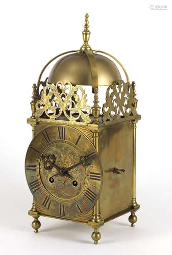 17th century style brass lantern clock striking on a bell, the dial with Roman numerals, 39.5cm high