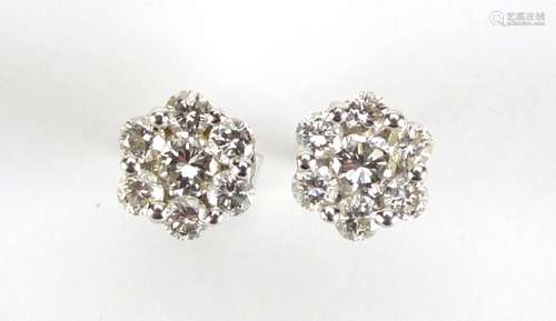 Pair of 18ct white gold diamond flower head earrings, 7mm in diameter, approximate weight 1.6g : For