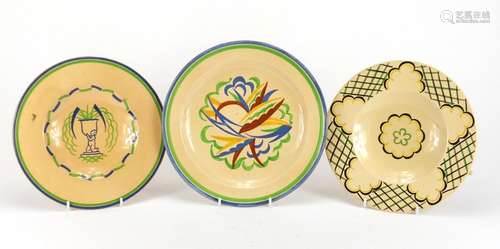 Two Ashtead pottery plates including one hand painted with stylised foliage, each with factory marks