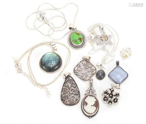 Ten silver pendants some set with semi precious stones and three silver necklaces, approximate