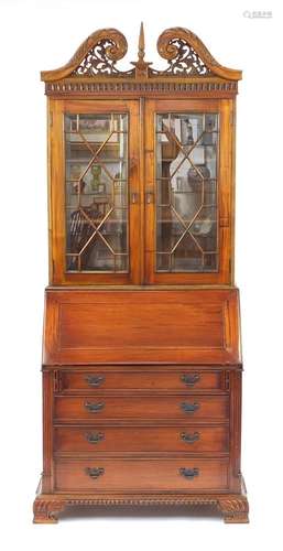 Mahogany bureau bookcase with a pair of astragal glazed doors, above a fall and four drawers on