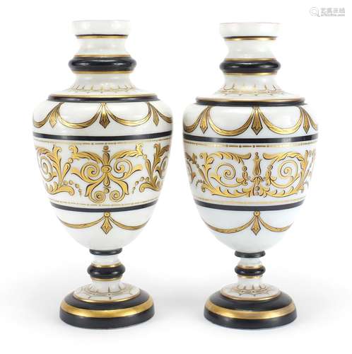 Matched pair of 19th century white opaline glass vases gilded with foliate motifs, each 29.5cm