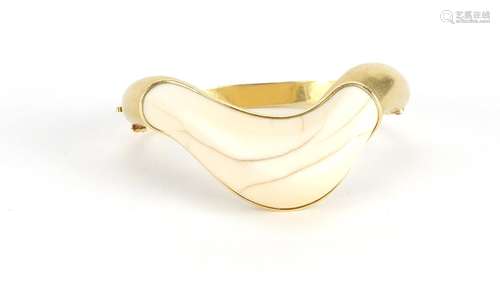 1970's modernist unmarked gold and ivory bangle, (tests as 18ct), 7cm wide, approximate weight 52.4g