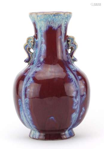 Chinese porcelain sang de boeuf glazed vase with twin handles, four figure character marks to the