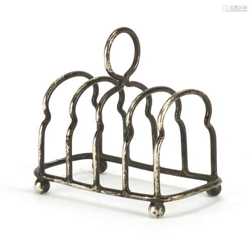 Victorian miniature silver four slice toast rack by Haseler Brothers, Chester 1902, 7.2cm in length,