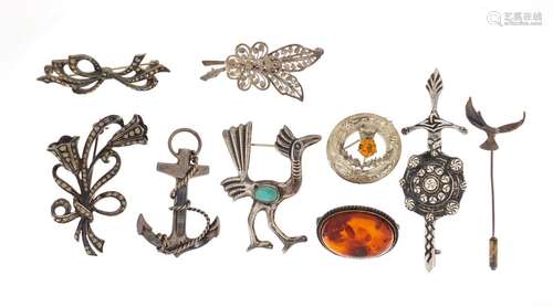 silver brooches including Scottish hardstone anchor, marcasite and amber : For Further Condition