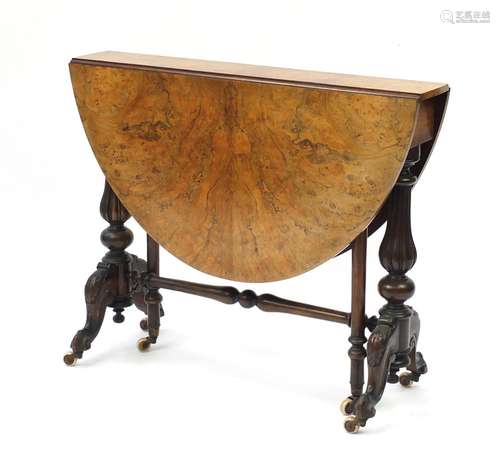 Good Victorian burr walnut Sutherland table, the oval top with quarter veneer on fluted legs, 73cm H