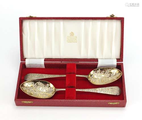 Pair of Victorian silver serving spoons engraved with flowers and gilt bowls, by George Whiting