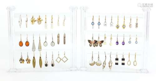 Twenty four pairs of earrings, some silver with display stand : For Further Condition Reports and