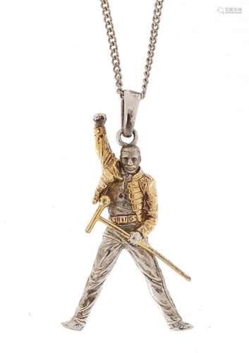 Silver gilt Freddie Mercury pendant on a white metal chain, the pendant 4cm in length, approximate