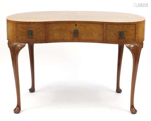 Waring & Gillow walnut kidney shaped dressing table with three drawers, on carved cabriole legs,