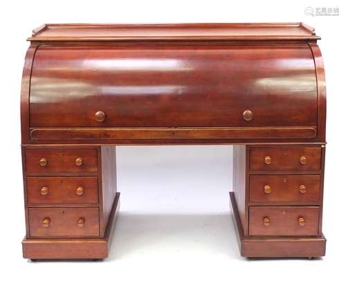 Mahogany twin pedestal cylinder bureau with fitted interior, pull out writing shelf and six drawers,