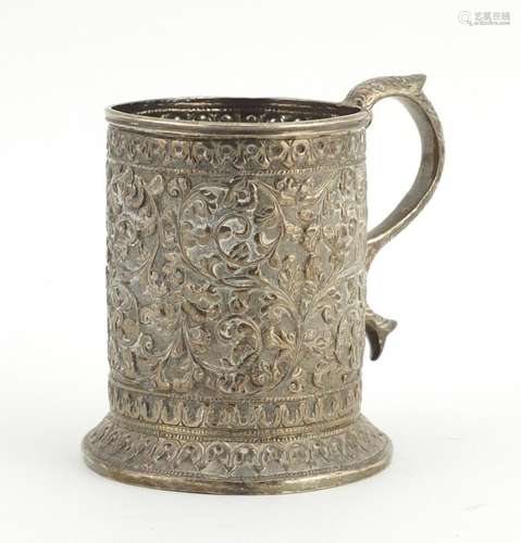 Middle Eastern unmarked silver tankard profusely embossed with flowers, engraved Souvenir de Maugo