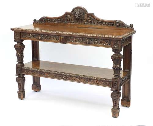 Oak two tier buffet with lion mask and leaf carvings, 112cm H x 137cm W x 45cm D : For Further