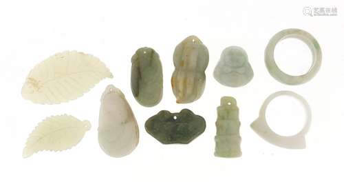 Eight Chinese carved jade pendants and two rings, the largest 4.6cm in length, approximate weight