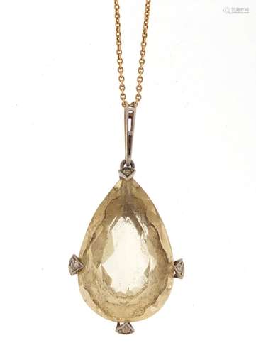 Unmarked gold citrine and diamond tear drop pendant on an unmarked gold necklace, the pendant 4.