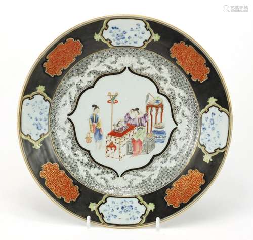 Chinese porcelain plate finely hand painted in the famille rose palette with two females, 23.5cm