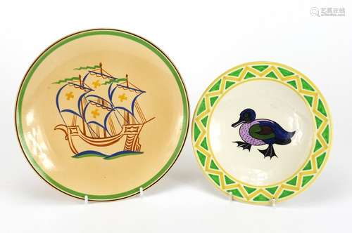 Two Ashtead pottery plates including one hand painted with a duck, each with factory marks to the