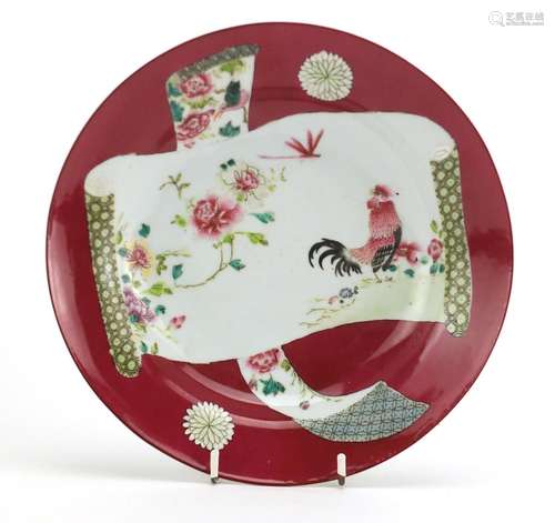 Chinese porcelain red ground shallow dish, hand painted in the famille rose palette with a cockerel,