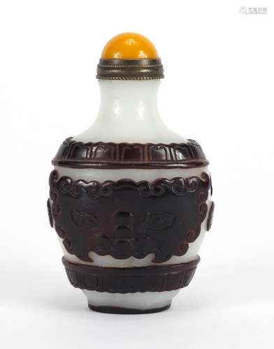 Chinese Peking cameo glass snuff bottle with stopper, decorated with mythical heads, 8cm high :