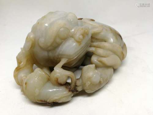 A HETIAN JADE CARVED LION-FROM ORNAMENT, QING
