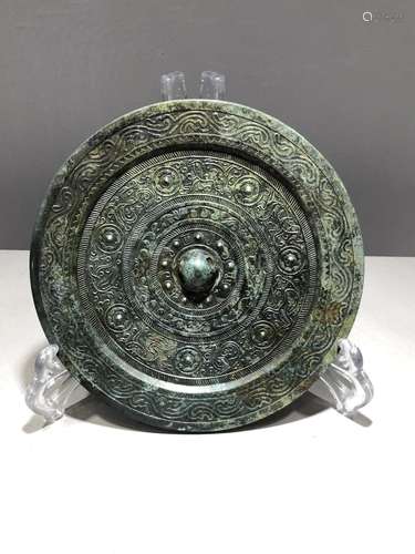 A BRONZE ARCHAISTIC CIRCULAR MIRROR, HAN DYNASTY