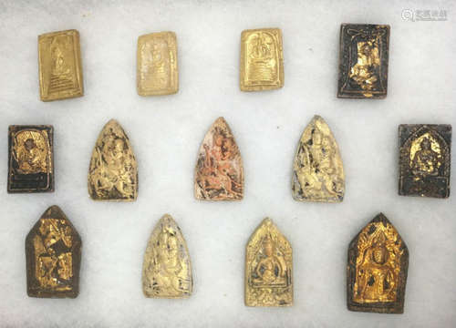 THIRTY GILT MUD BUDDHA PLAQUES, TANG DYNASTY