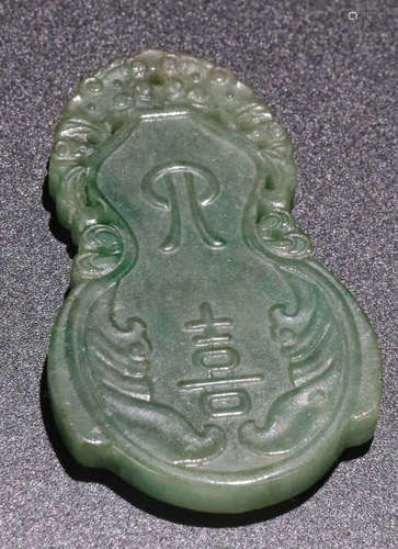 A JADEITE CARVED AUSPICIOUS PATTERN PENDANT