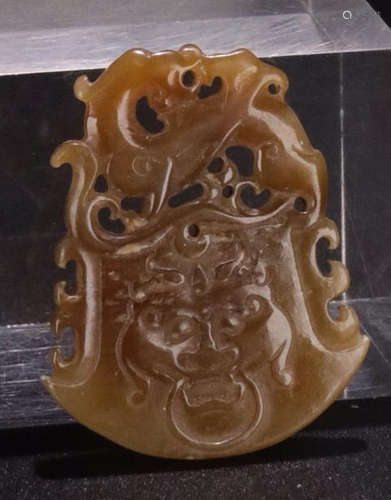 A HETIAN JADE CARVED BEAST PATTERN PENDANT