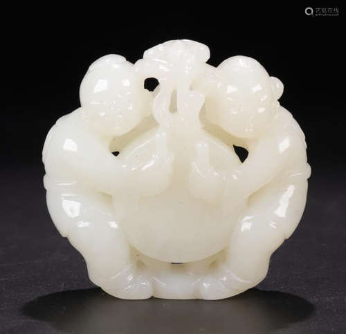 A HETIAN JADE CARVED CHILD SHAPED PENDANT