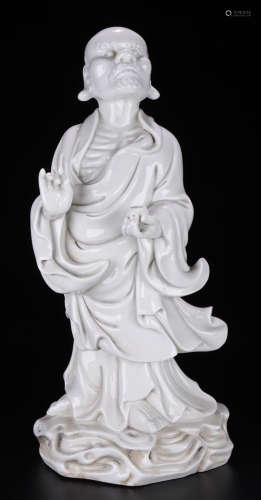 A WHITE GLAZE LUOHAN BUDDHA STATUE